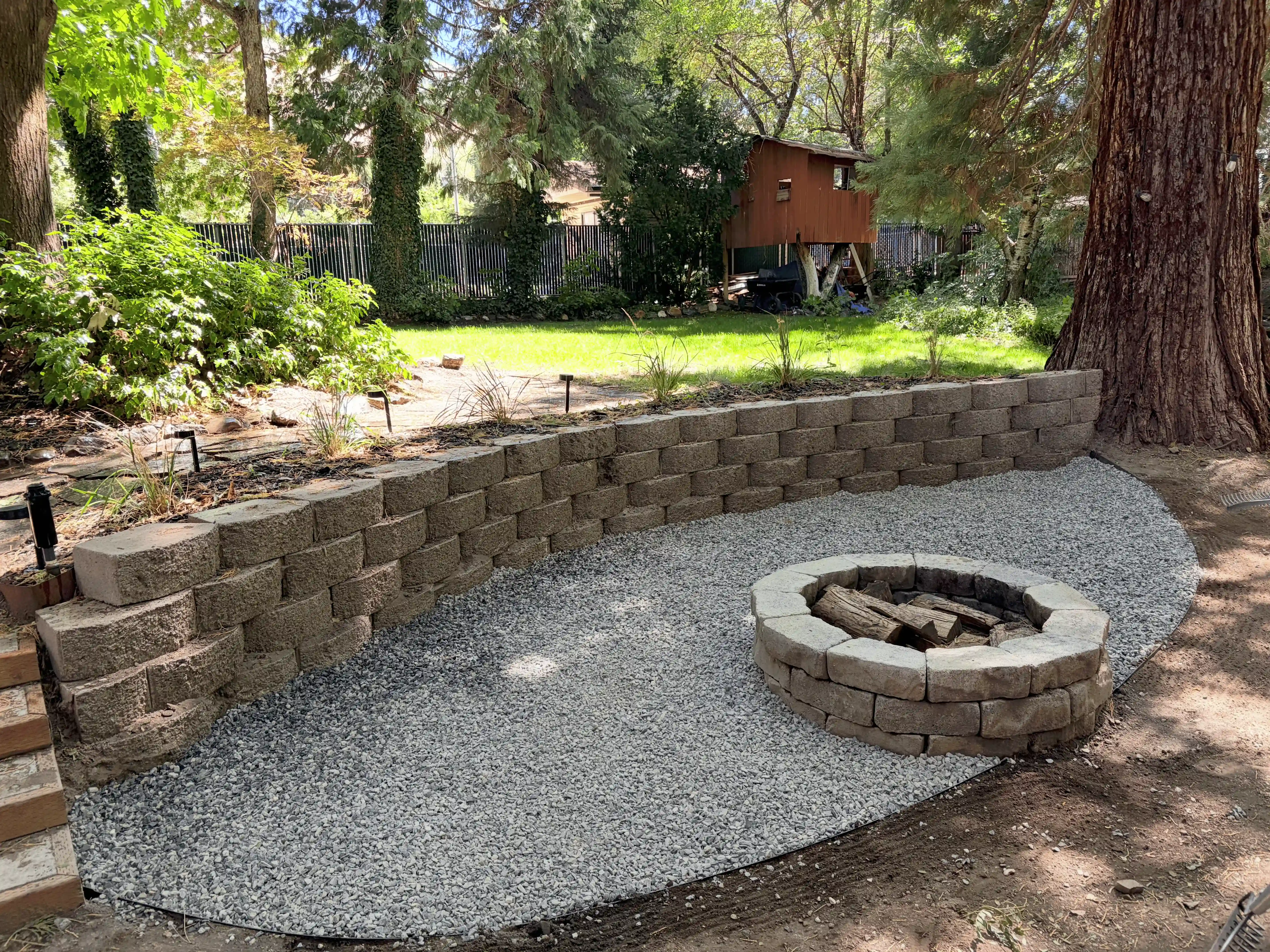 Finished landscape beds and plantings on a Davis County property
