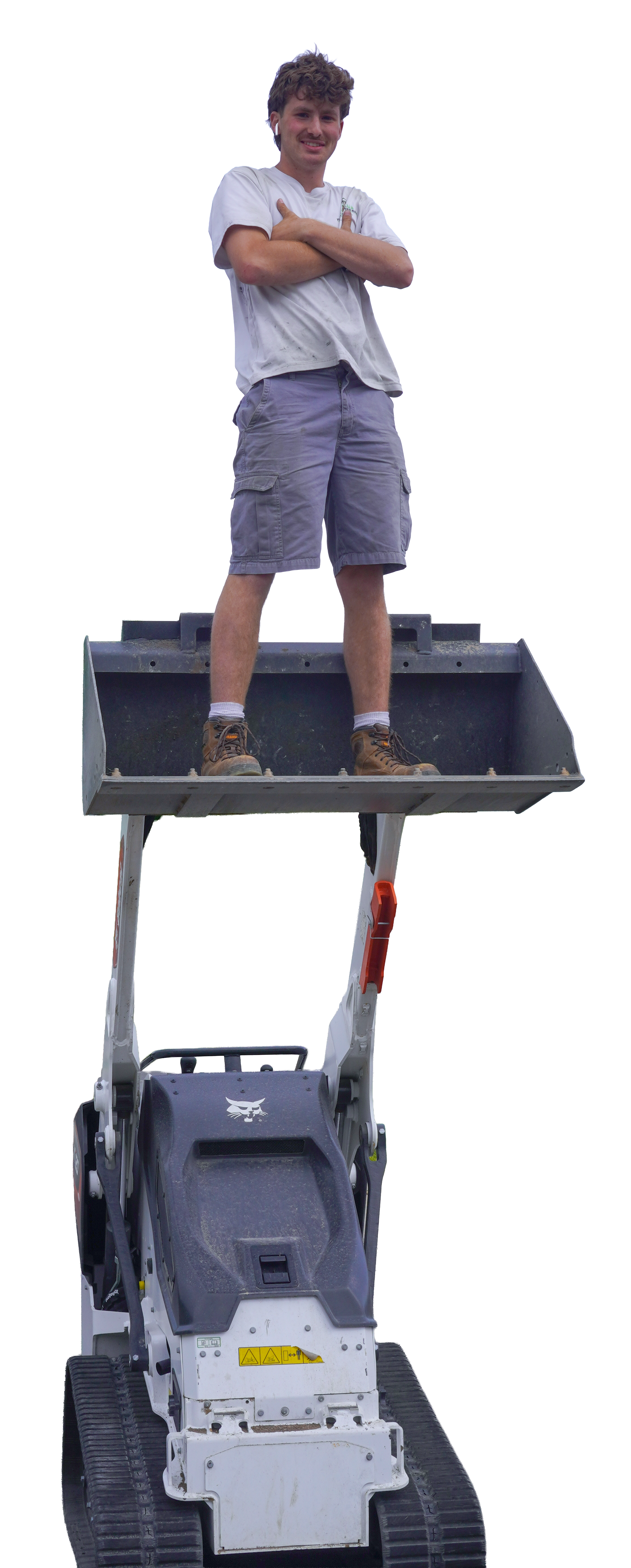 McGuire Barton standing in a Bobcat loader bucket