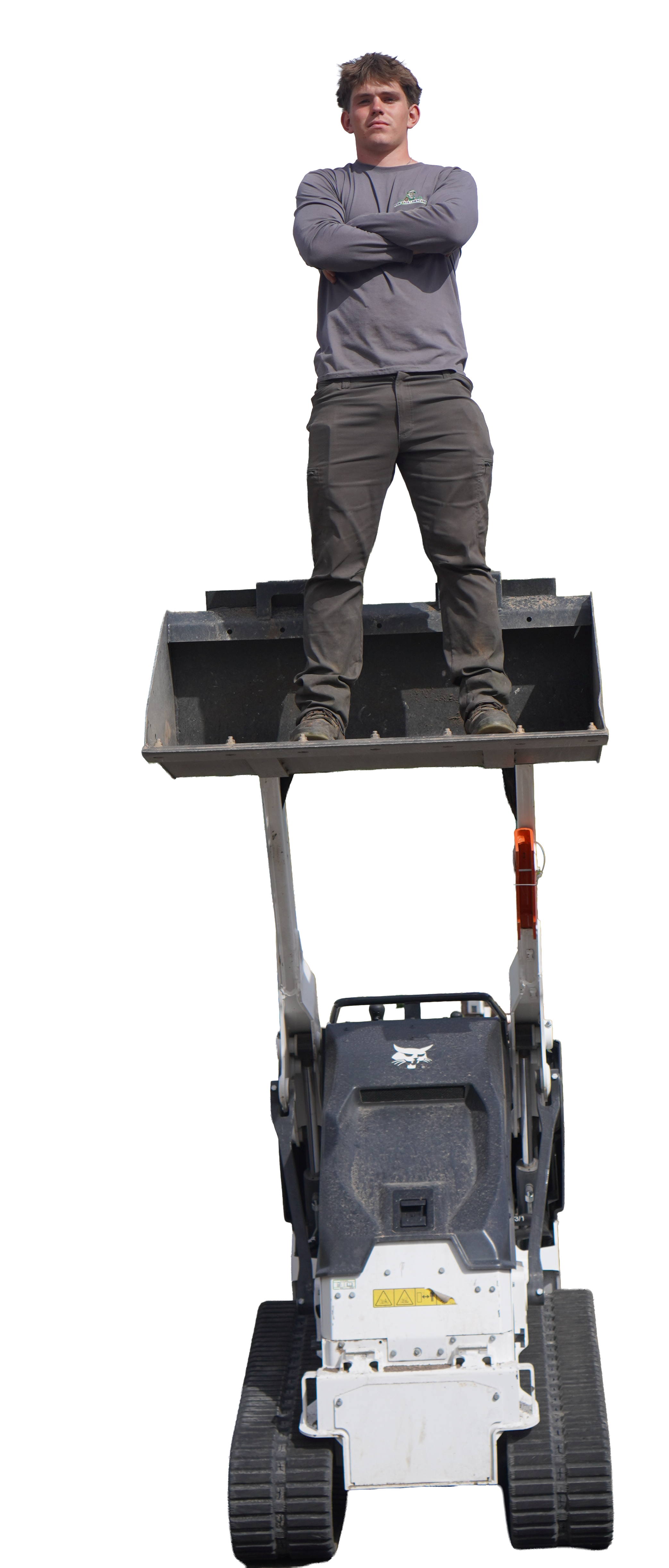Will Vanderlinden standing in a Bobcat loader bucket